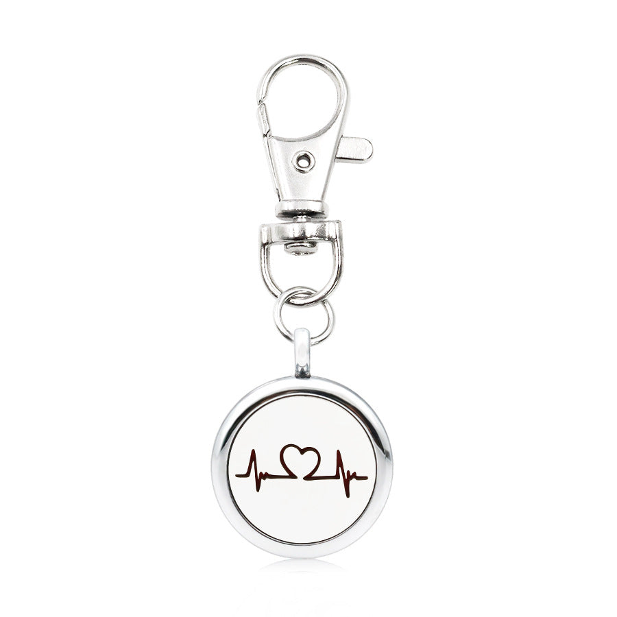 Wholesale Alloy Angel Wings Hollow Aromatherapy Essential Oil Keychain